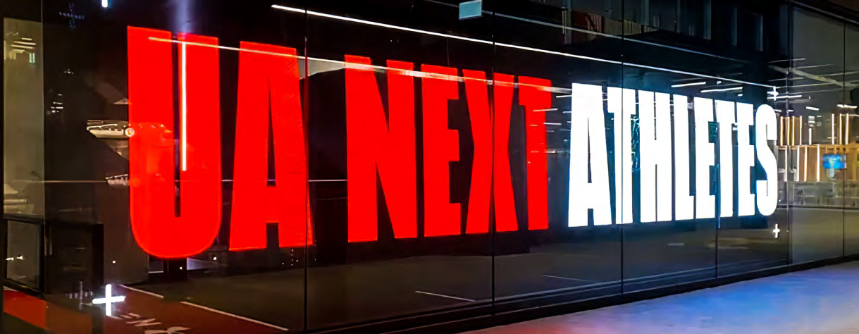 Under Armour transparent LED storefront with UA NEXT ATHLETES graphics